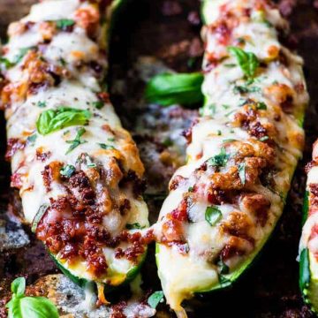 Zucchini pizza boats with cheese topping.