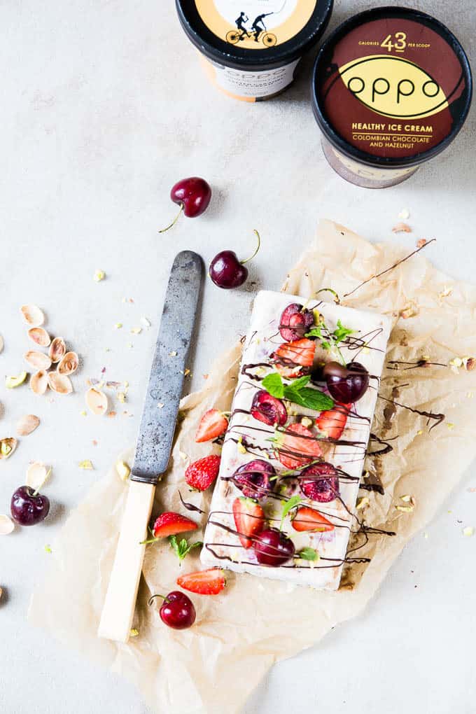 Two layers of creamy healthy ice cream, sandwiched together and topped with aaaaallll the summer fruit and drizzled with some dark chocolate. Ice cream cake... we are so ready for you!