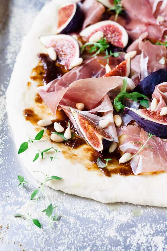 This fig and prosciutto pizza is the perfect dinner lifesaver. Ditch the pepperoni and jazz up pizza night with onion marmalade, juicy ripe figs and creamy salty prosciutto.