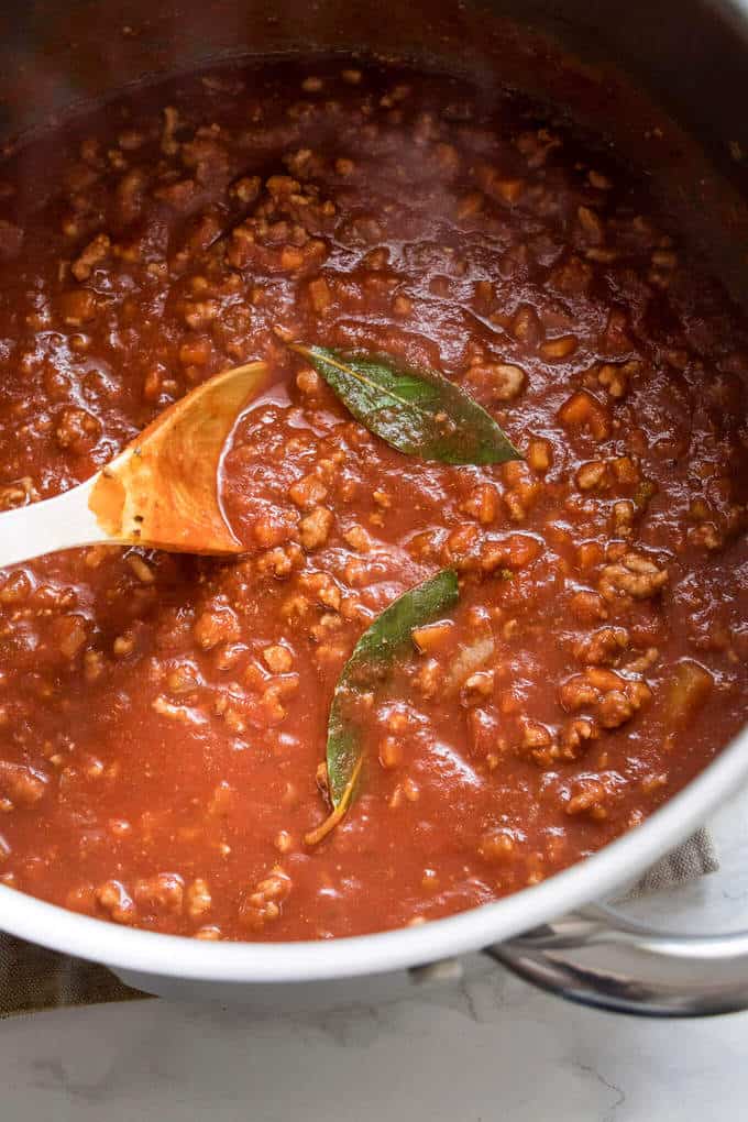 This simple bolognese sauce is a modern take on the cosy comfort classic. Rich meaty sauce loaded with herbs and spices and Vegetables. It skips the long simmer and comes together in under an hour.