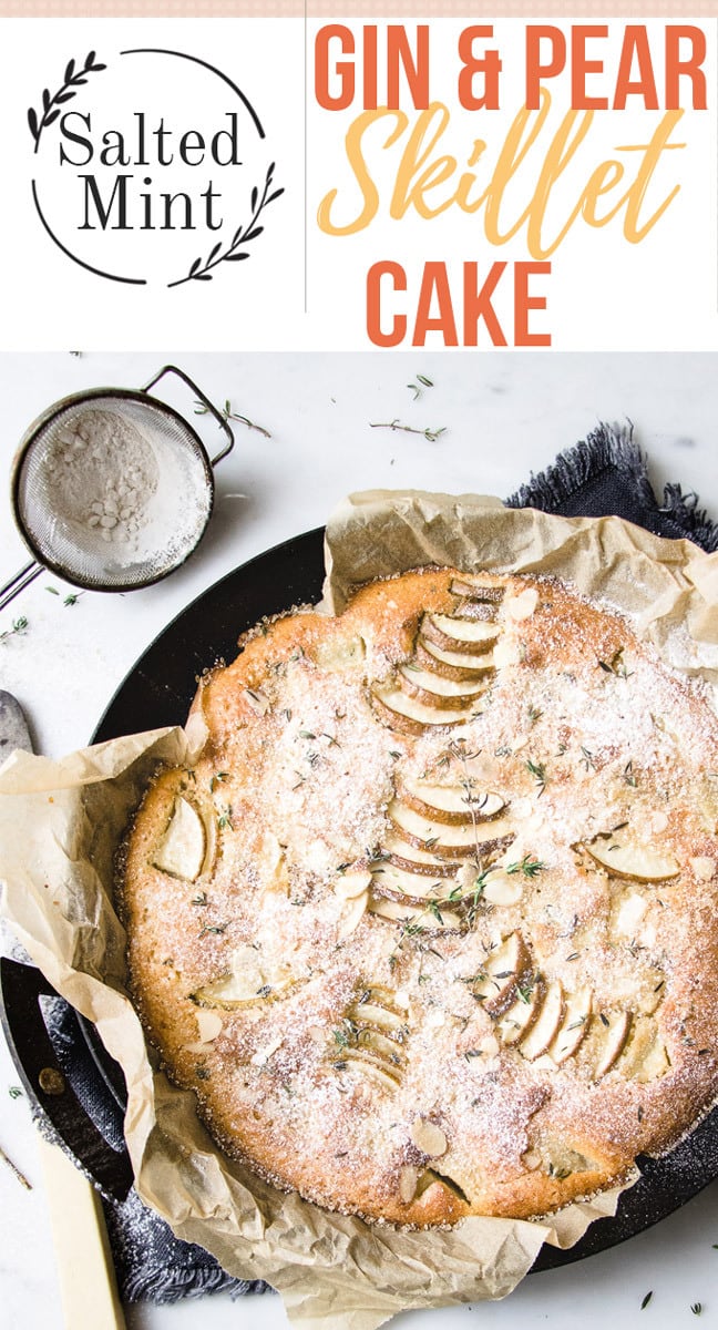 Pear and gin cake in a cast iron skillet with text overlay.
