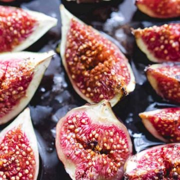 Honey-roasted figs on a baking tray.
