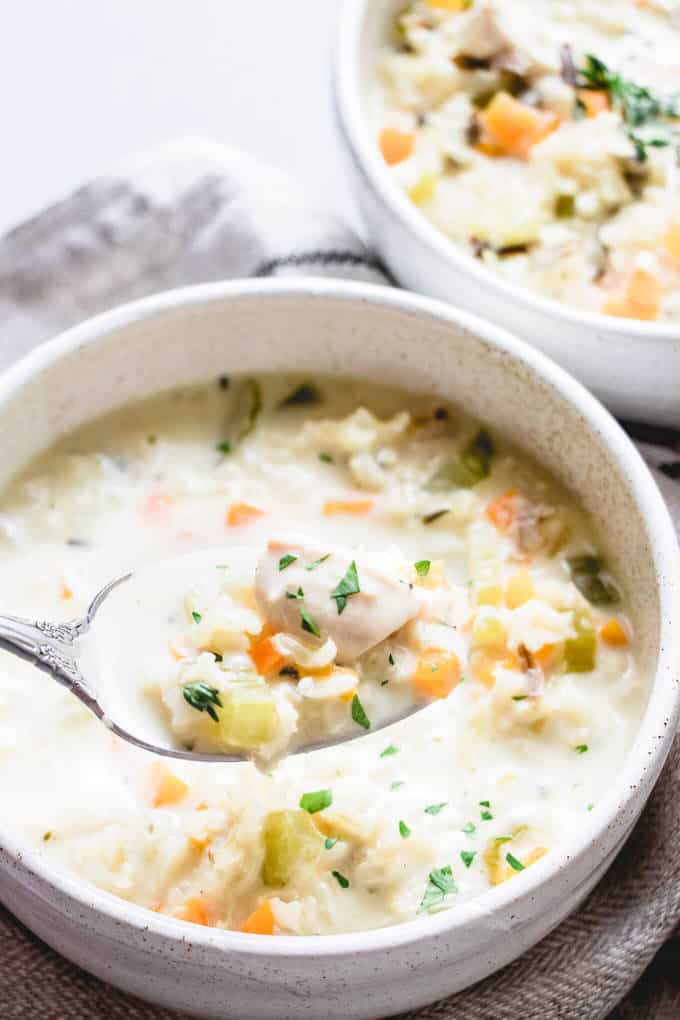 There's no better way to keep the fall wind at bay than to sit down and cozy up with this nourishing and hearty lightened up creamy chicken rice soup.