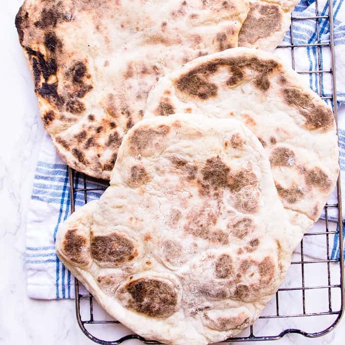 Miracle 2 ingredient naan bread creamy Greek yogurt mixed with fluffy self raising flour and a pinch of salt.
