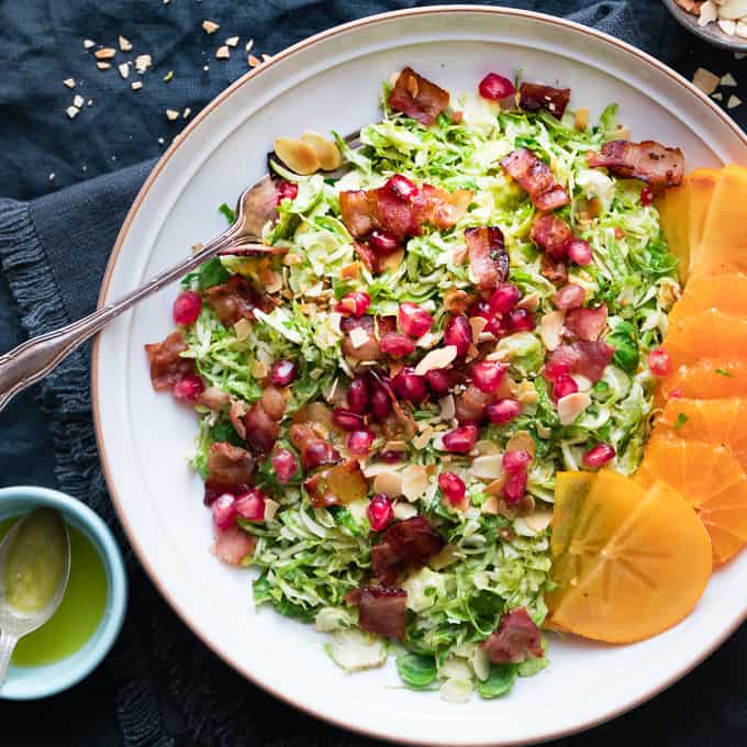 It's delicate shaved sprouts, warm and crispy bacon and bright citrus vinaigrette with toasted almonds.