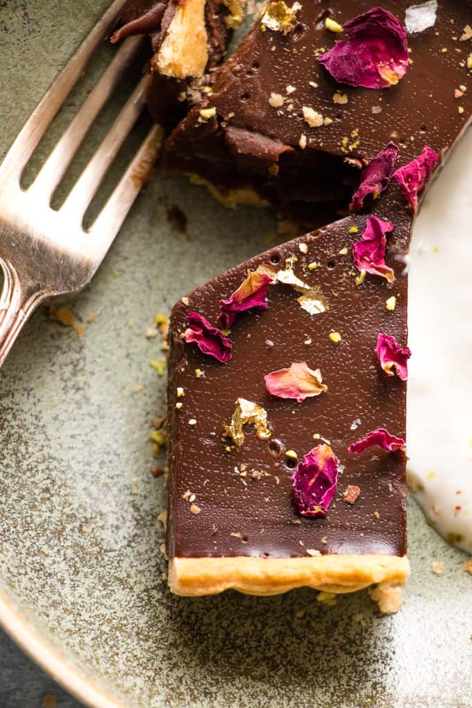 This is the creamiest dreamiest chocolate truffle tart that you will ever eat. Dark smooth chocolate, in a crispy flaky crust, topped with hazelnuts.