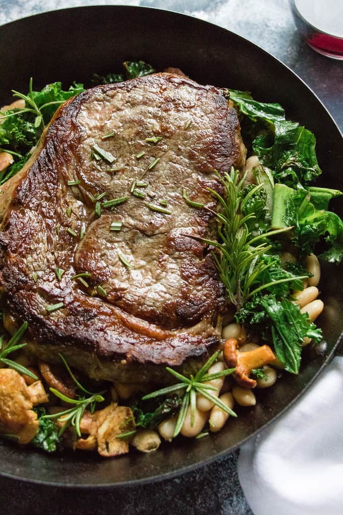 This Epic Rib Eye Steak is the perfect one pan dinner. Juicy beef, fragrant rosemary, and crispy kale make this the perfect recipe for date night in or is elegant enough to serve company.