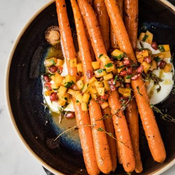 Roasted carrot side dish with spiced yogurt.