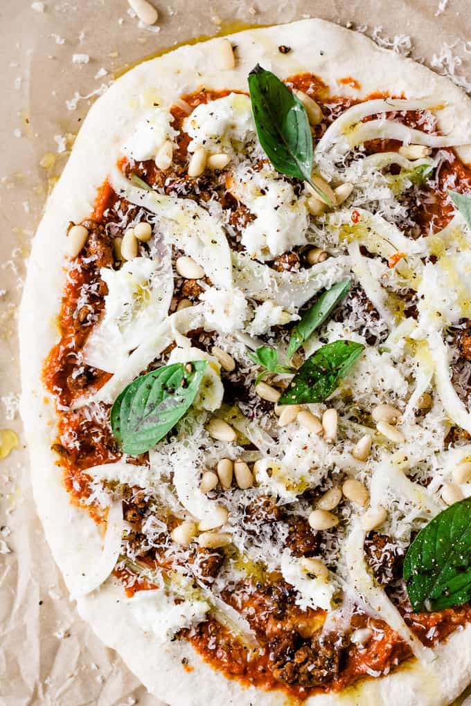 This spicy chorizo and fennel pizza is a tribute to the seasons. Deep rich roasted red pepper sauce, spicy chorizo to get that blood flowing and earthy, slightly aniseed-y fennel to bring it all together. 