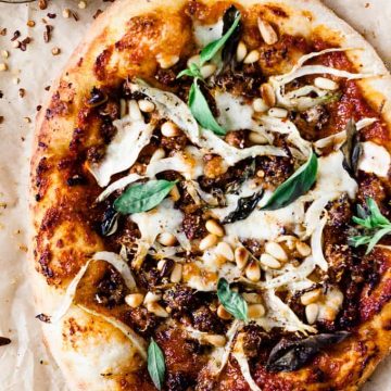 Spicy chorizo and fennel pizza on a table.