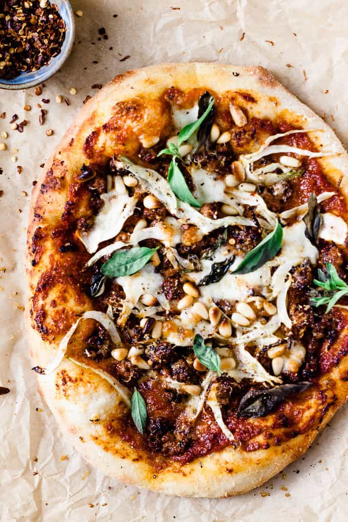 This spicy chorizo and fennel pizza is a tribute to the seasons. Deep rich roasted red pepper sauce, spicy chorizo to get that blood flowing and earthy, slightly aniseed-y fennel to bring it all together. 