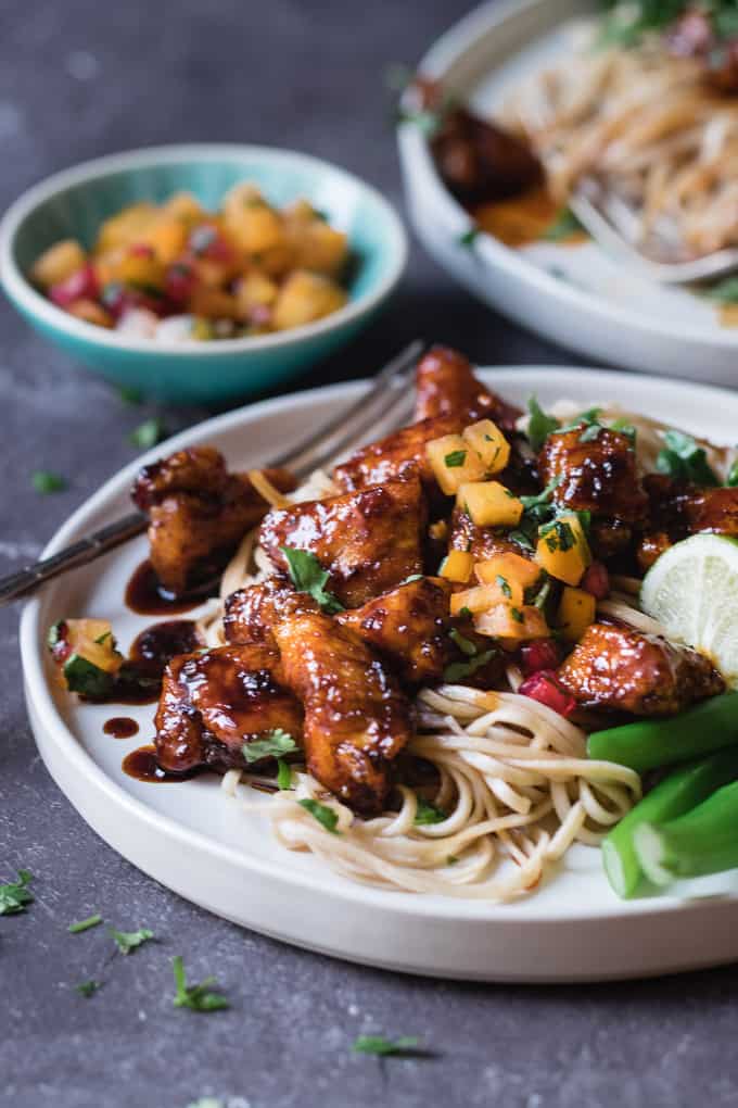 This easy Korean spicy chicken is my current weeknight favourite quick dinner. Crispy and tender pieces of chicken tossed in a sticky, sweet and spicy chilli sauce and served with a fruity winter salsa. 