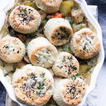 Turkey and mushroom pie with herb biscuit topping.