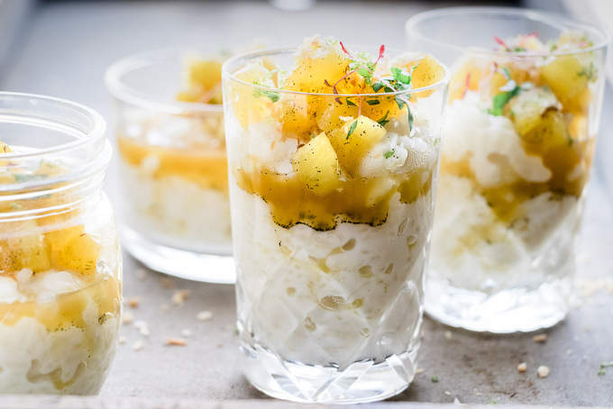 This warm and creamy coconut rice pudding is a the perfect comfort dessert. It's made with fragrant kaffir lime and coconut milk. Topped with vanilla and brown sugar pineapple, it's family friendly and vegan. Ready in 25 minutes.