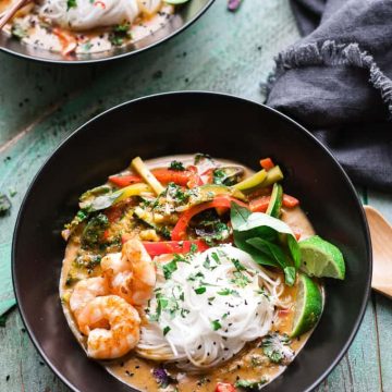 Bowls of red thai curry noodles.