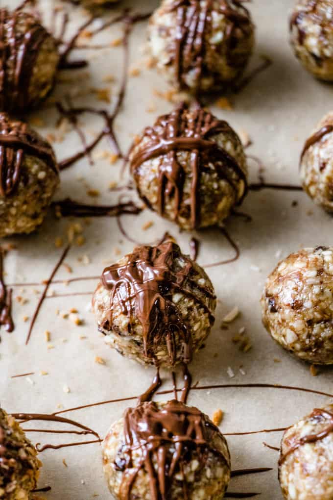 You can call these energy balls, bliss bites, dessert bites and anything else you want. I call them bet-you-can't-eat-only-one delicious.  Almonds and hazelnuts mixed with coconut and a kiss of maple syrup for sweetness. Totally healthy, protein packed and gluten free.