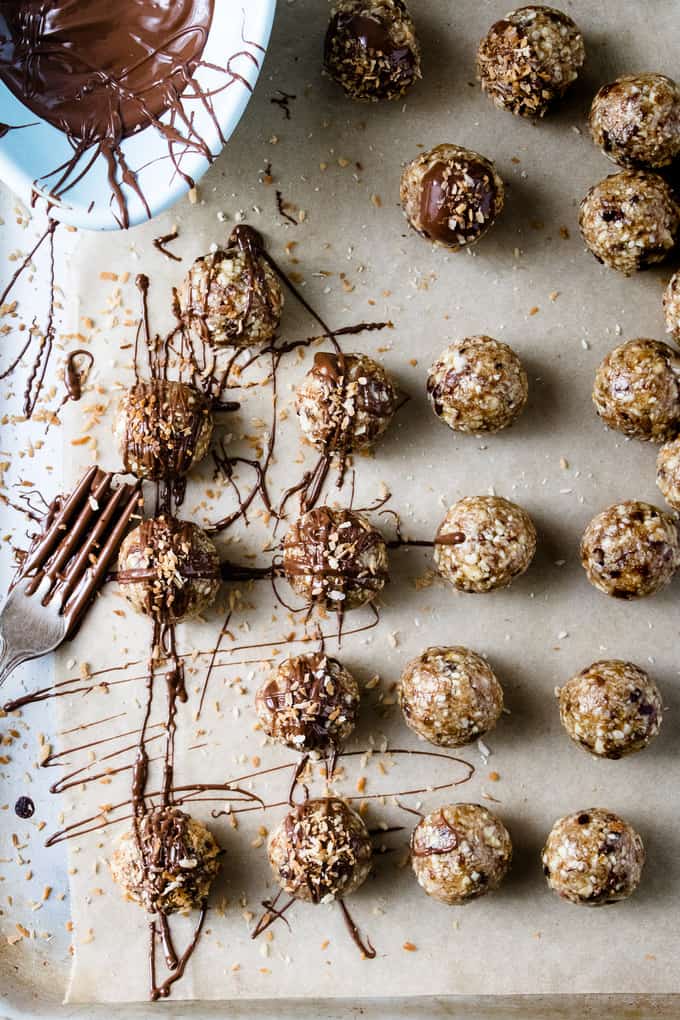 You can call these energy balls, bliss bites, dessert bites and anything else you want. I call them bet-you-can't-eat-only-one delicious.  Almonds and hazelnuts mixed with coconut and a kiss of maple syrup for sweetness. Totally healthy, protein packed and gluten free.