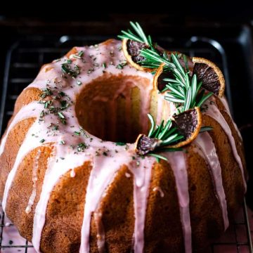 Blood orange rosemary bundt cake on cooling rack.