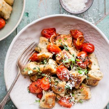 Ricotta gnocchi with cherry tomatoes and herbs.