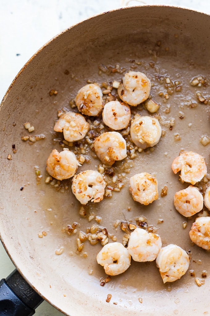 Shrimp in a pan with garlic and chilli.