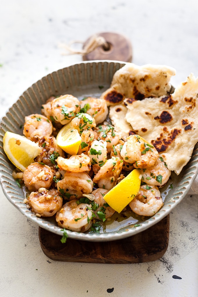 Garlic Butter Shrimp In a Dish with parsley and lemon