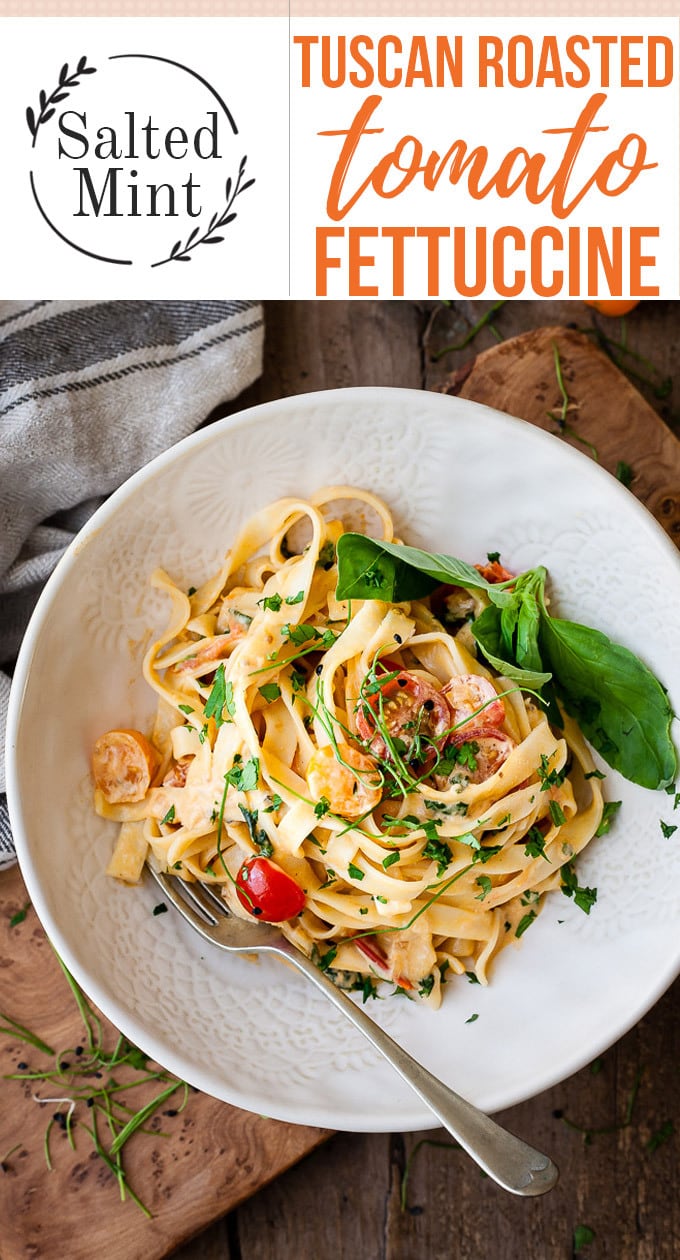 Creamy tomato pasta with text overlay.