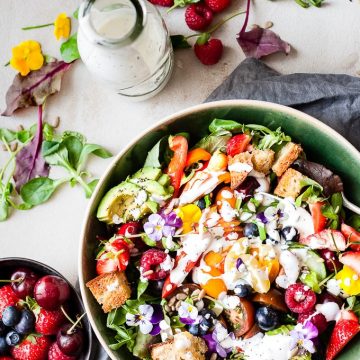 Garden Salad with fruit and dressing.