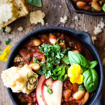 Cowboy beans in a skillet with cornbread.