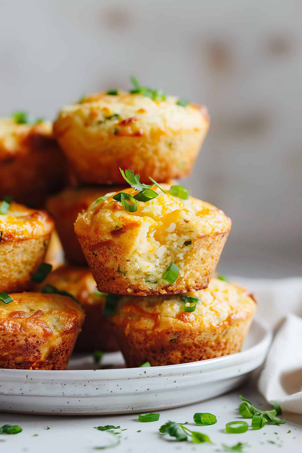 Jalepeno cheddar cornbread muffins on a plate.