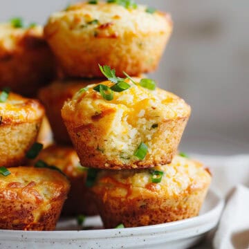 Jalepeno cheddar cornbread muffins on a plate.