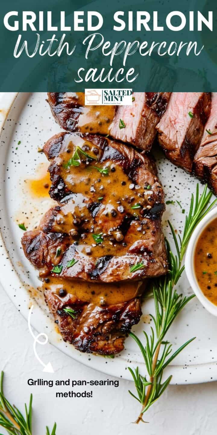 Grilled sirloin with whiskey peppercorn sauce on a white plate.