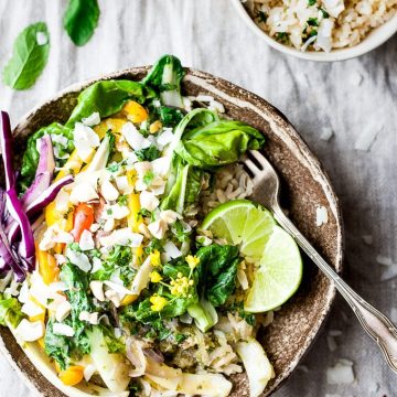 Vegetarian Thai green curry in a bowl with fork.