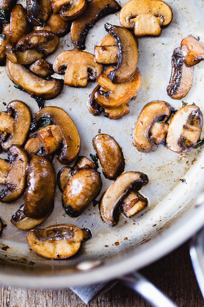 Golden mushrooms in a pan for easy beef stroganoff with rice.