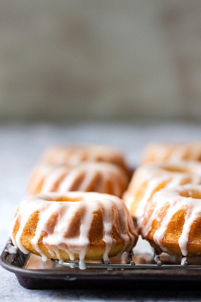 Mary Berry's lemon drizzle cake on a cake stand.