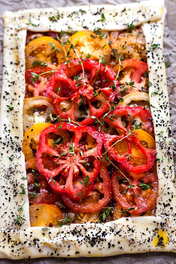 Tomato tart with seeds in a puff pastry crust.