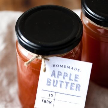 Apple butter in a jar with a gift tag.