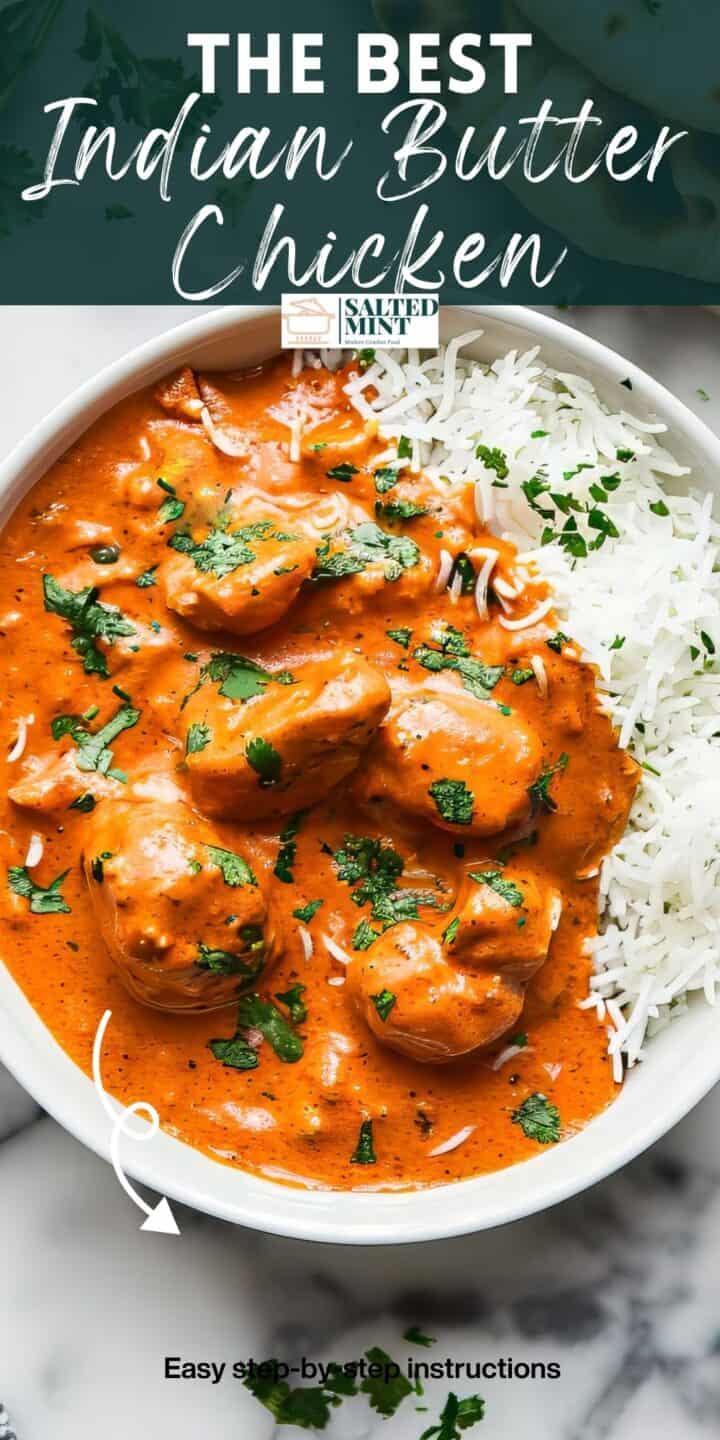 Indian butter chicken in a white bowl with rice and herbs.