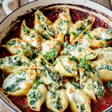 Spinach and ricotta stuffed shells with tomato sauce.