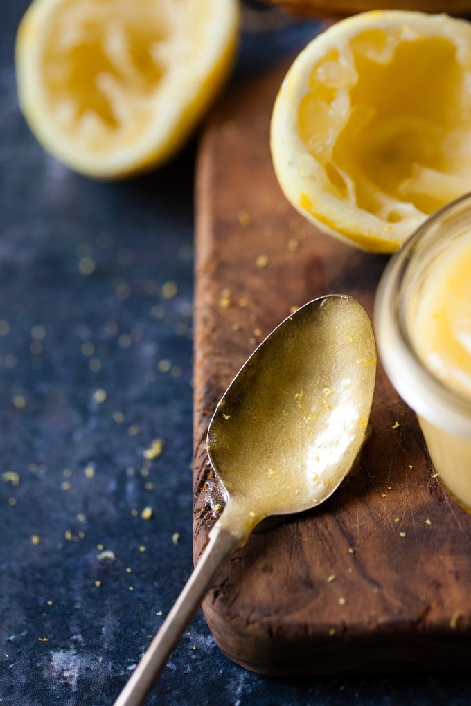 close up of lemon curd on a spoon.