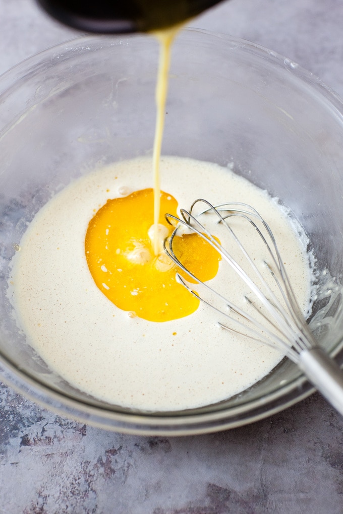 Butter drizzling into batter.
