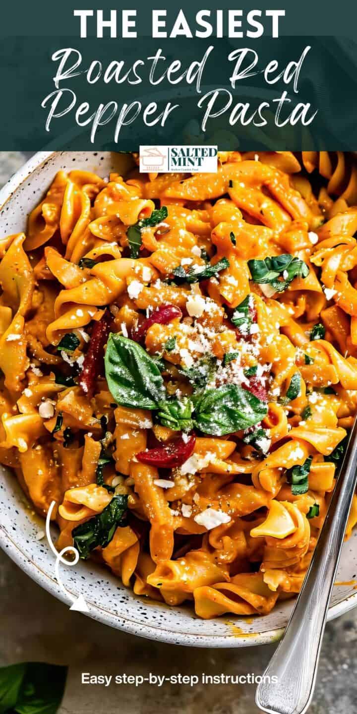 Roasted red pepper pasta with spinach in a bowl.