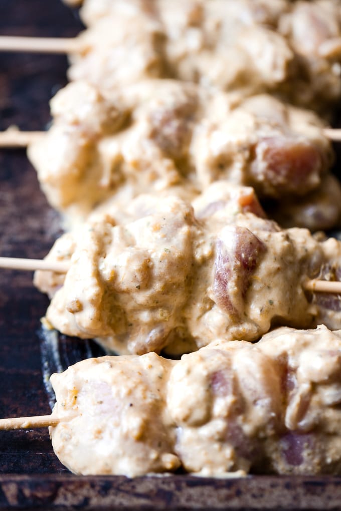 Thai chicken skewers on a baking tray.