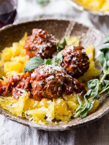 Italian Lamb Meatballs in a bowl with red wine.