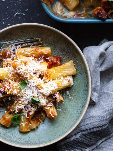 Arrabiata pasta bake with cheese in a bowl.