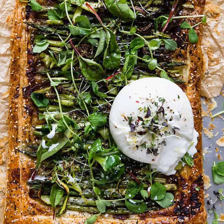 Asparagus and puff pastry tart with burrata.