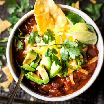Black bean chilli with avocado and chips.