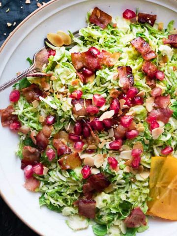 Brussels sprouts salad with vinaigrette in a bowl.
