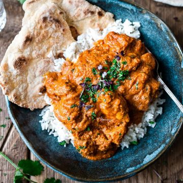 The best Indian Butter Chicken in a blue bowl.