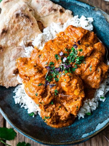 The best Indian Butter Chicken in a blue bowl.