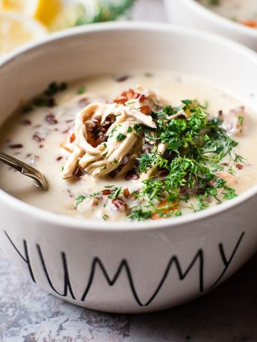 Chicken and wild rice soup with parsley and mushrooms.